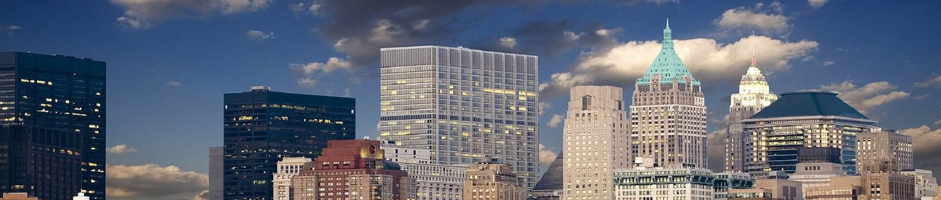 New York financial district skyline illuminated at dusk